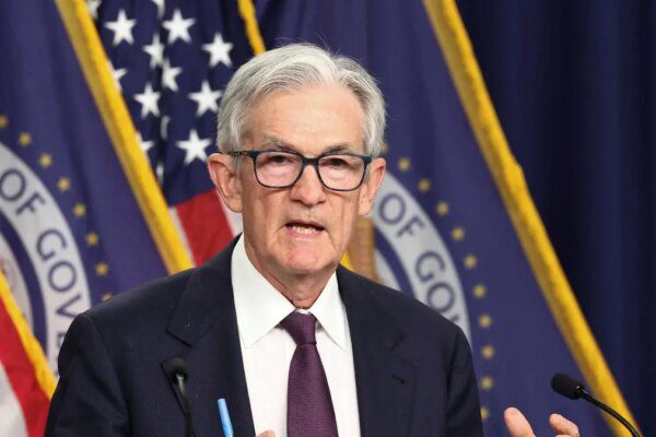 Fed holds rates steady, flags rising risks of inflation and unemployment